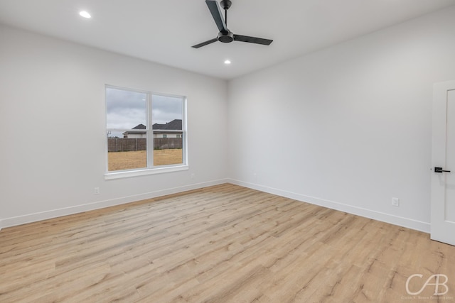 empty room featuring light wood-type flooring and ceiling fan