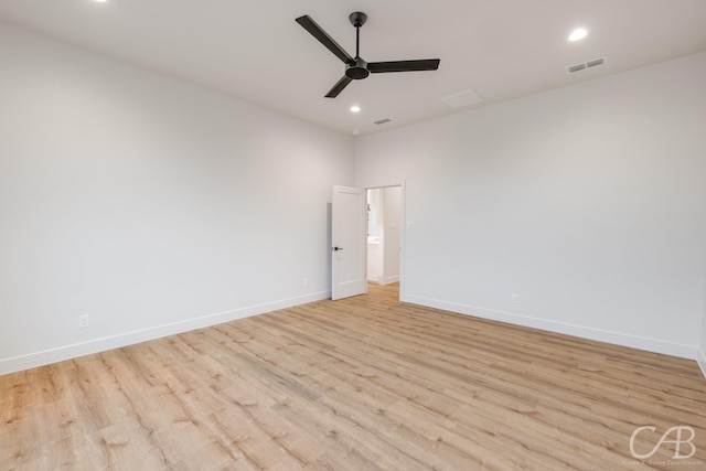 unfurnished room with ceiling fan and light hardwood / wood-style flooring