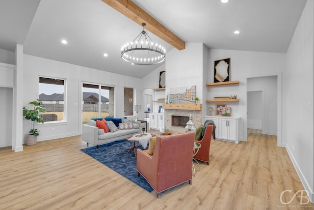 living room featuring light hardwood / wood-style flooring, high vaulted ceiling, beamed ceiling, a chandelier, and a fireplace