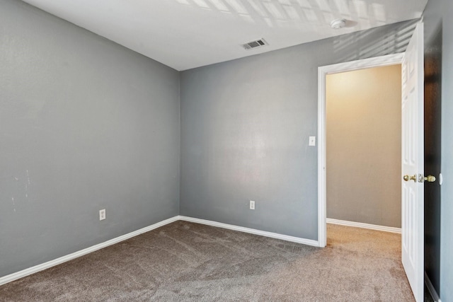 spare room with light colored carpet