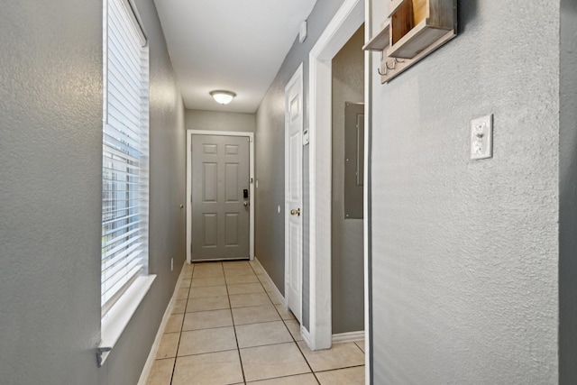 corridor featuring light tile patterned floors