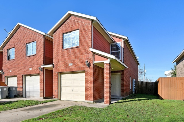 view of front of house featuring a garage and a front yard