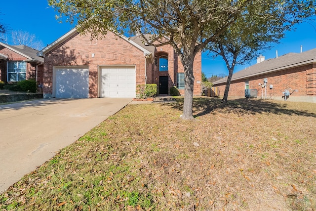 view of front of house featuring a garage and a front lawn