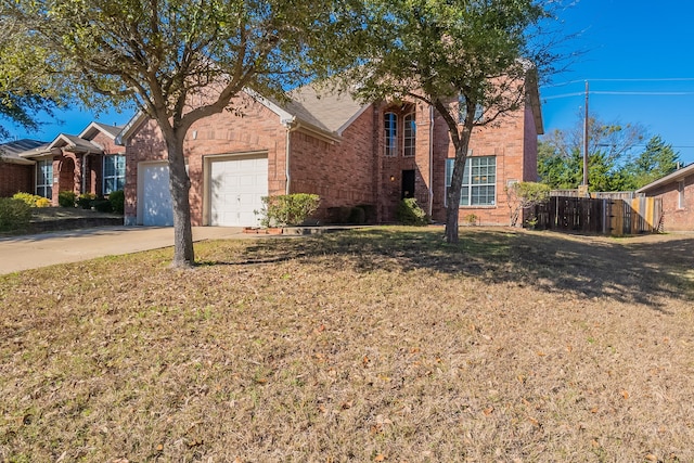 view of front facade featuring a garage and a front lawn