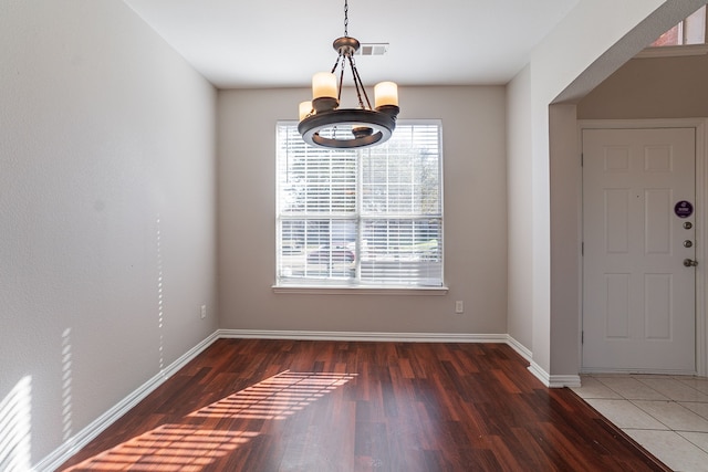 interior space with dark hardwood / wood-style floors and a chandelier