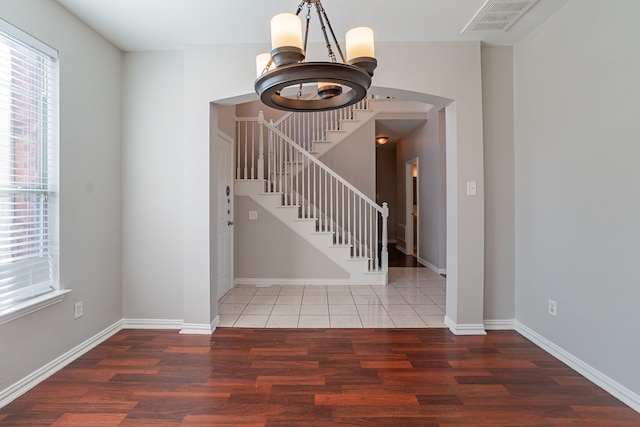 entryway with dark hardwood / wood-style flooring