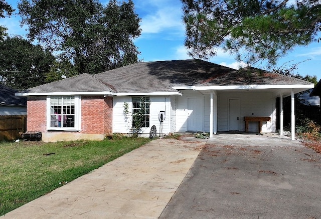 single story home with a carport and a front yard