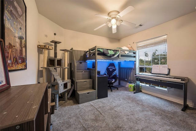 bedroom with ceiling fan and carpet floors