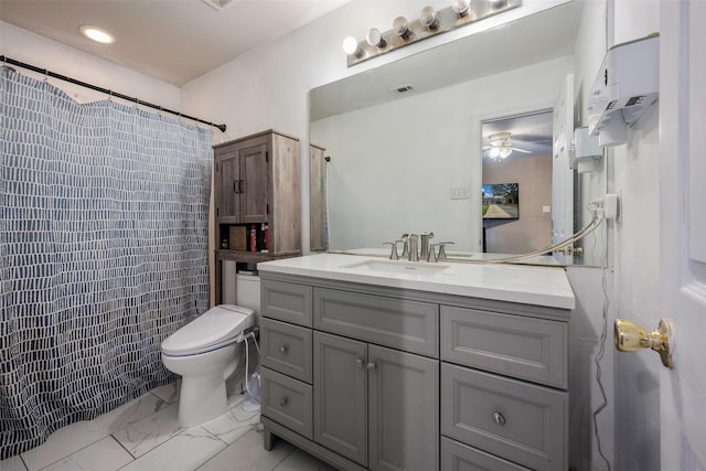 bathroom featuring a shower with curtain, ceiling fan, toilet, and vanity