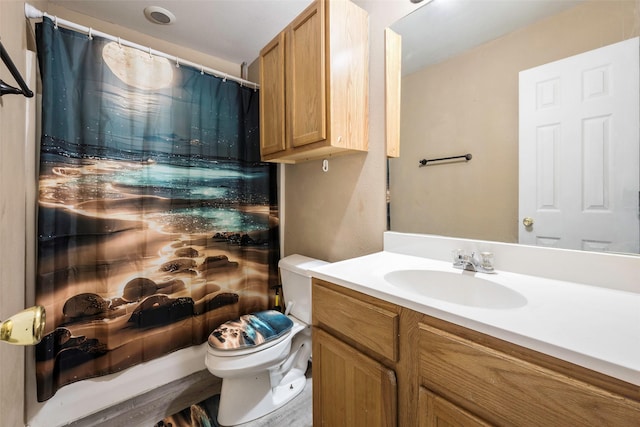 bathroom featuring vanity and toilet