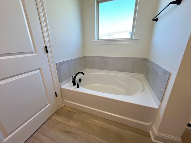 bathroom featuring a bath