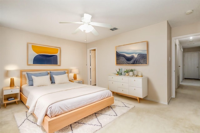 bedroom with light colored carpet and ceiling fan