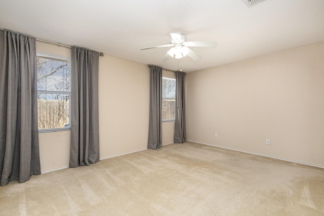 carpeted empty room with ceiling fan