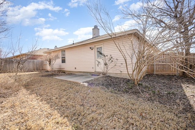 back of house with a patio