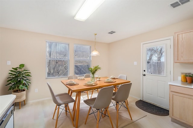 dining area with light wood-type flooring