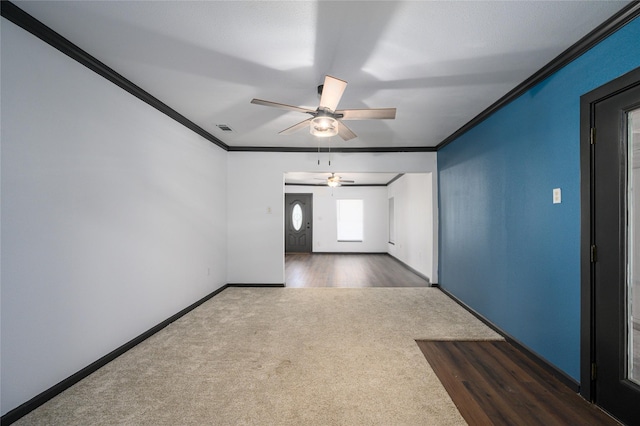 carpeted spare room with ornamental molding and ceiling fan