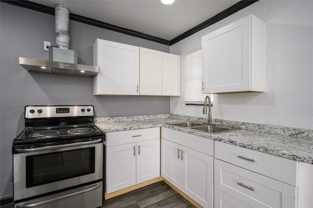 kitchen with sink, white cabinetry, electric range, ornamental molding, and wall chimney range hood