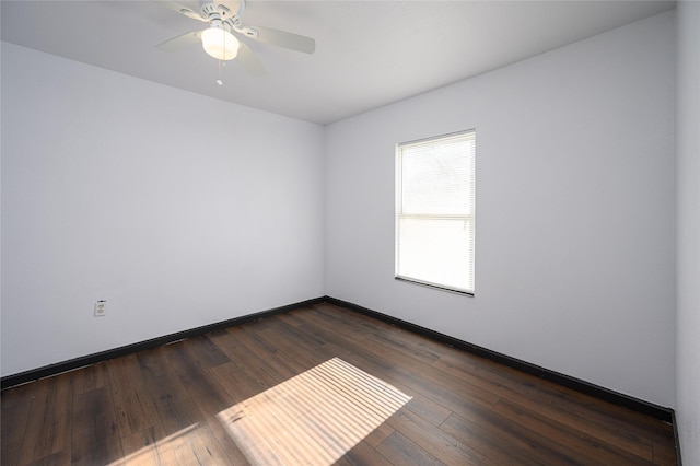 empty room featuring dark hardwood / wood-style floors and ceiling fan