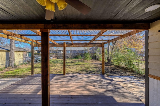 deck with ceiling fan and a pergola