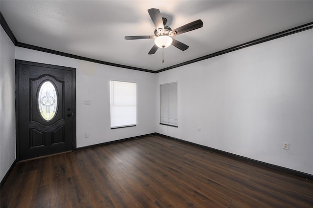 foyer entrance with dark hardwood / wood-style flooring, ceiling fan, ornamental molding, and a healthy amount of sunlight