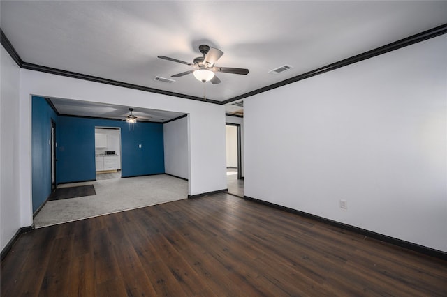 spare room with ornamental molding, dark hardwood / wood-style floors, and ceiling fan