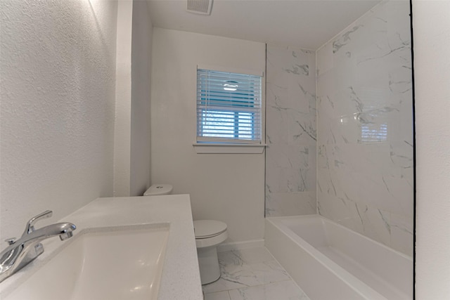 full bathroom featuring vanity, toilet, and tiled shower / bath