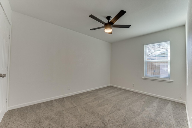 spare room with carpet and ceiling fan