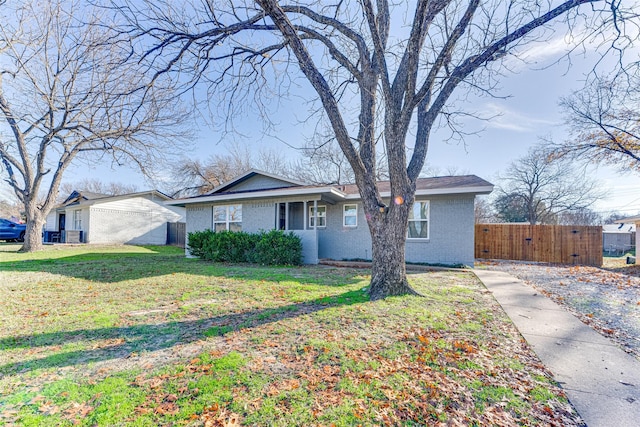 ranch-style home featuring a front yard