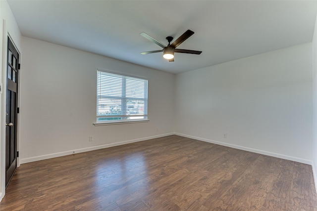 unfurnished room featuring ceiling fan and dark hardwood / wood-style flooring