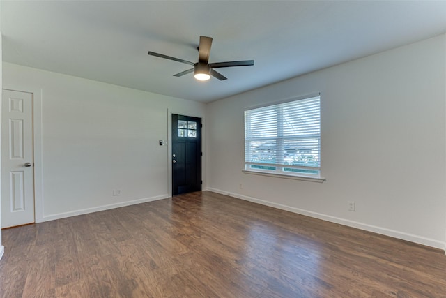 interior space with ceiling fan and dark wood-type flooring