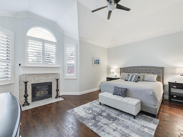 bedroom featuring ceiling fan, dark hardwood / wood-style floors, and multiple windows