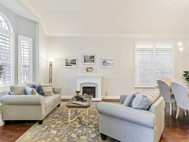 living room with dark wood-type flooring and ornamental molding