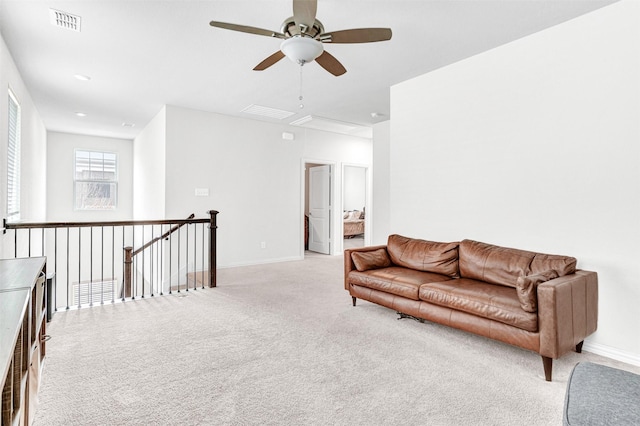 sitting room featuring light carpet