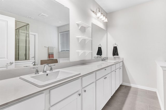 bathroom featuring vanity and an enclosed shower