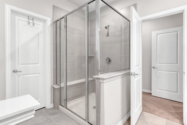 bathroom featuring tile patterned floors and walk in shower