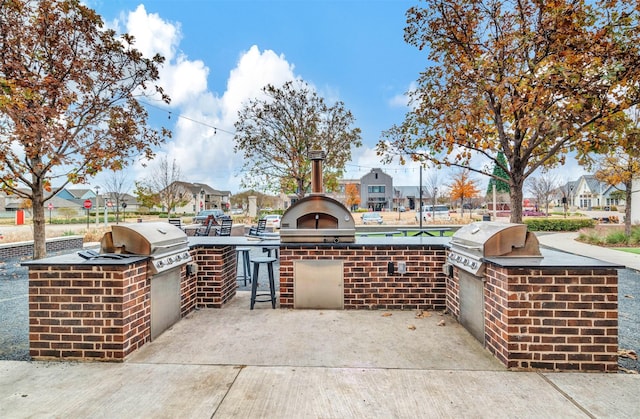 view of patio with grilling area and exterior kitchen