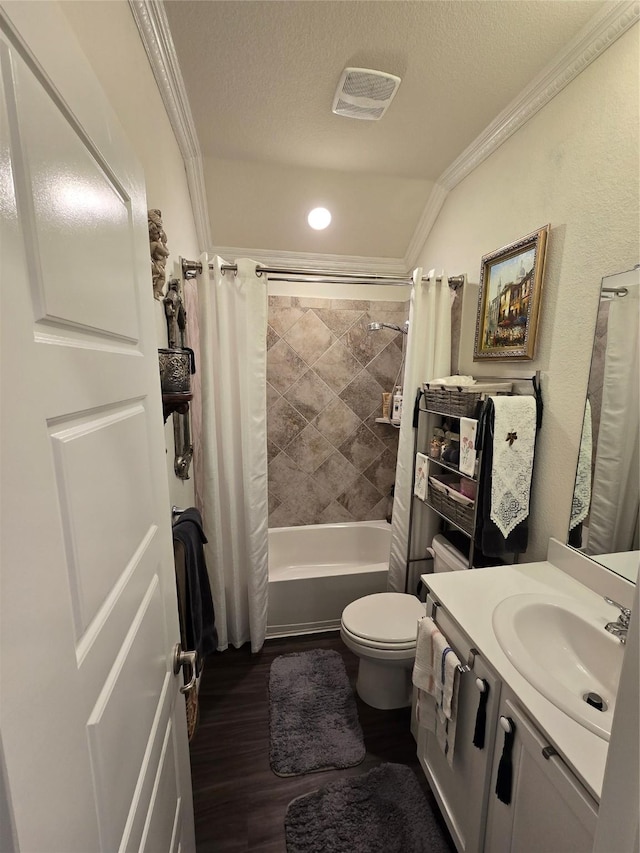 full bathroom featuring crown molding, wood-type flooring, a textured ceiling, and shower / bath combo