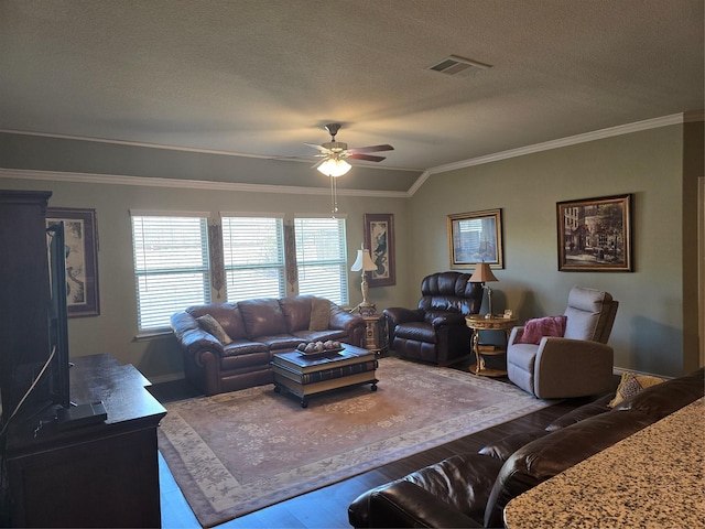 living room with crown molding, ceiling fan, hardwood / wood-style flooring, and a textured ceiling