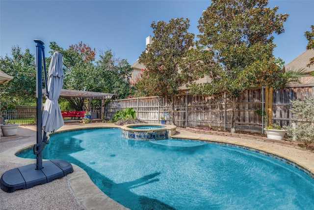 view of pool with an in ground hot tub