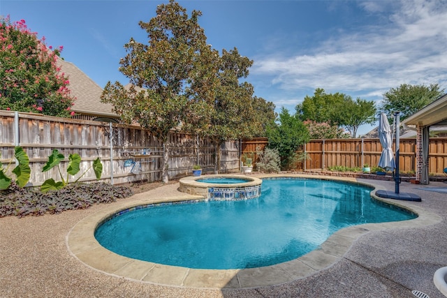 view of pool with an in ground hot tub