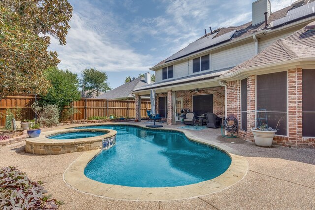 view of swimming pool featuring ceiling fan, an in ground hot tub, and a patio