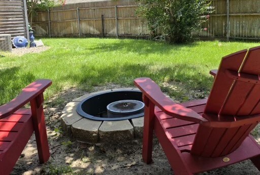 view of yard featuring an outdoor fire pit