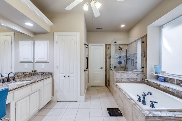 bathroom featuring tile patterned floors, vanity, separate shower and tub, and ceiling fan