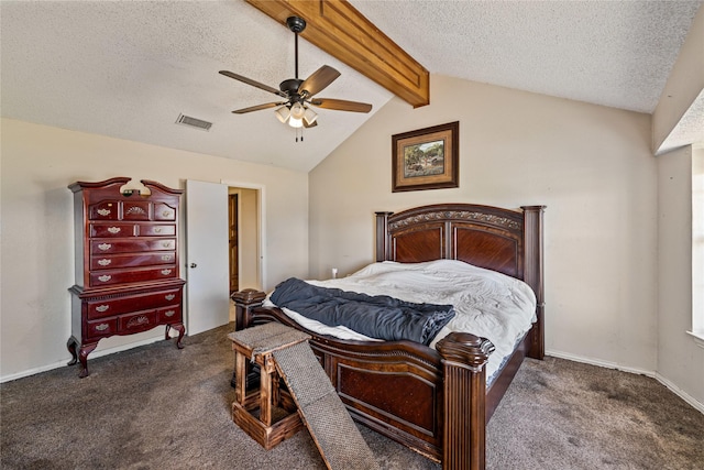 bedroom featuring lofted ceiling with beams, dark colored carpet, ceiling fan, and a textured ceiling