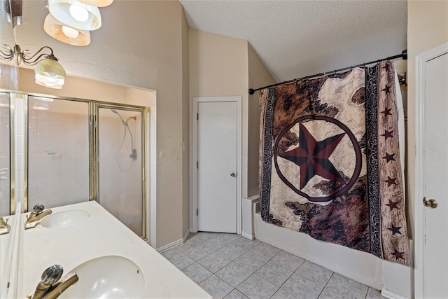 bathroom with tile patterned flooring, vanity, shower / bath combination, and a textured ceiling