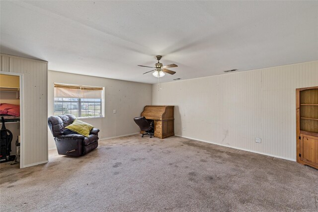 unfurnished room with carpet flooring and ceiling fan