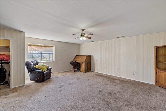 unfurnished room featuring carpet and ceiling fan