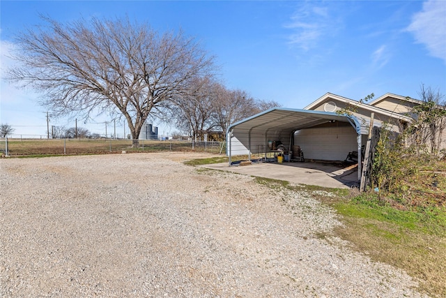 exterior space with a carport