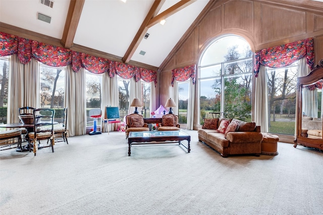 sunroom / solarium featuring lofted ceiling with beams