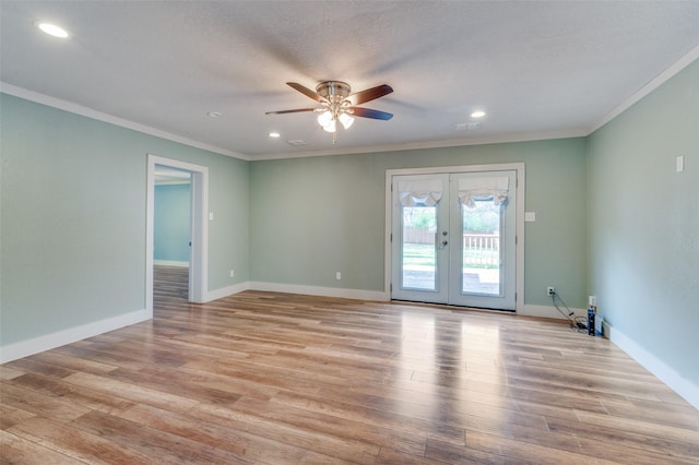 empty room featuring ceiling fan, french doors, light hardwood / wood-style floors, a textured ceiling, and ornamental molding